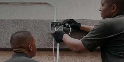 Temflex application image of electrician working on residential junction box 
