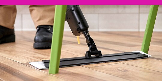 3M Easy Trap dusting tool with a cleaning professional’s feet in the background.
