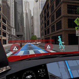 Car on road with the automotive head up display showing sensors tracking the location of the road and a pedestrian.