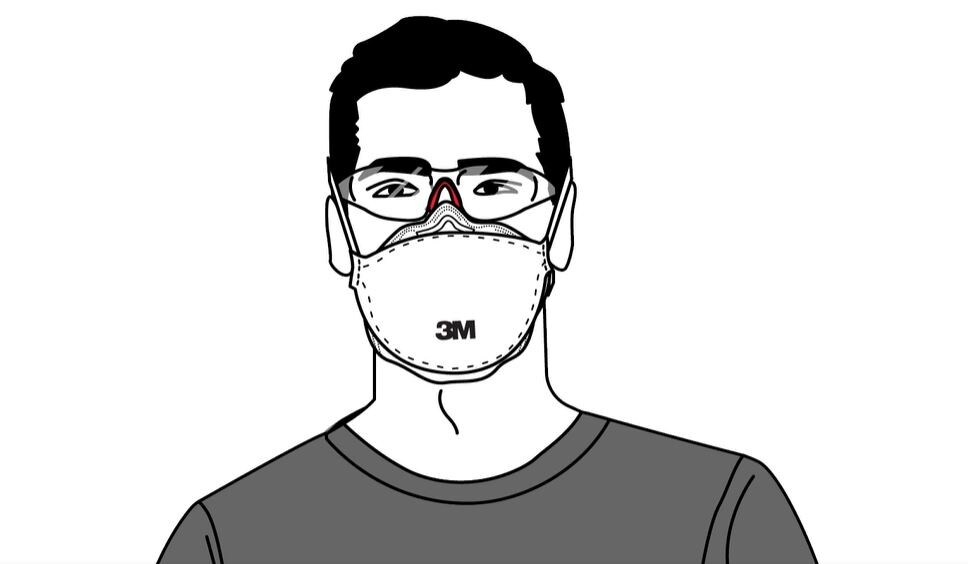 A man wearing a  respirator and eye protection showing compatibility among protective gear
