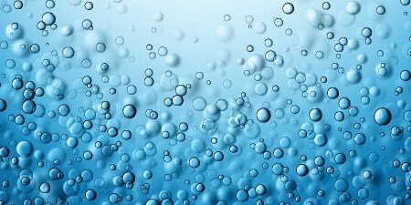 青背景に浮かぶガス気泡
