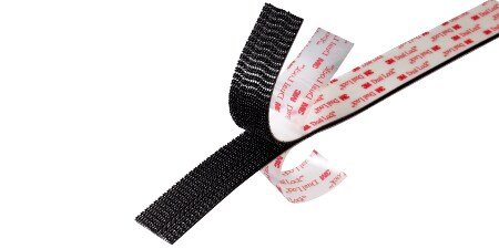 Image of a partly separated strip of 3M™ Dual Lock™ Tape that also shows the protective liners peeling back

