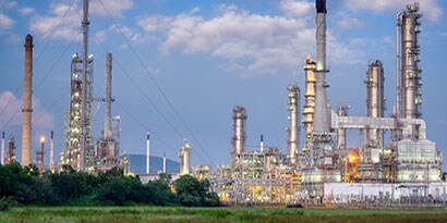 Oil and gas refinery on a blue sky background.
