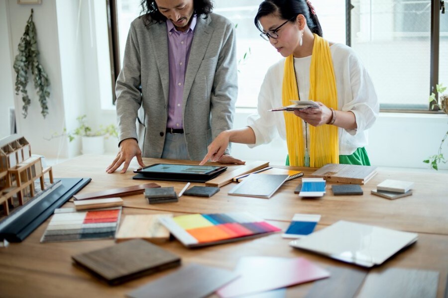 Two interior designers discussing in the studio
