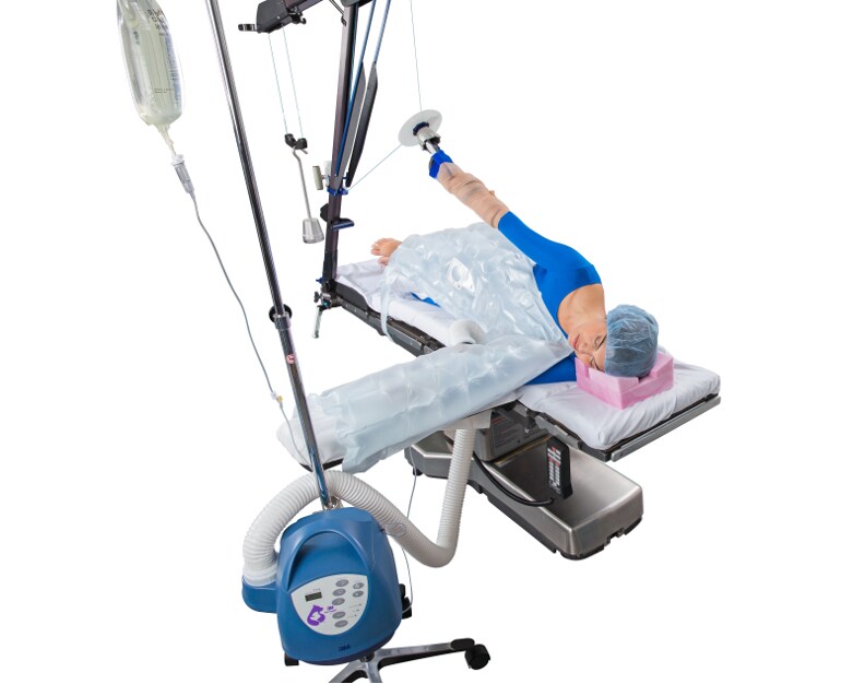 Learn how to use the Bair Hugger multi-position blanket to warm with traction device
