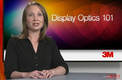  An image of a woman at a desk with a title of Display Optics 101.
