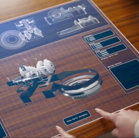 A large area for sensing and imaging showing visualizations of technology on a desk.