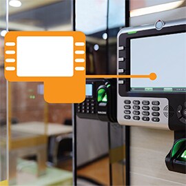 Image of a control device outside a room, with a graphic indicating where adhesive is holding layers together