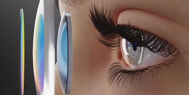 A person's eye looking into three different lenses for augmented reality/virtual reality.
