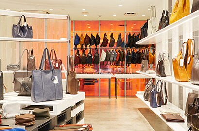 Retail interior handbag store display multicolor glass